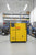 Yellow HPC compressor with 'Kaeser' branding in an industrial setting