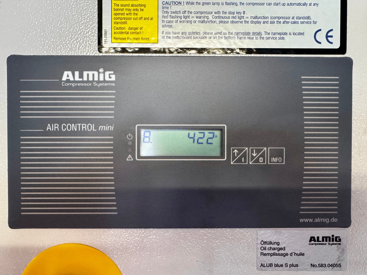 Almig Compressor Systems Air Control mini display panel, showing a digital temperature readout of 42.2 degrees Celsius with a yellow warning label at the top and product details at the bottom.