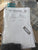 Test certificate and USB drive inside a clear plastic bag with Atlas Copco branding.