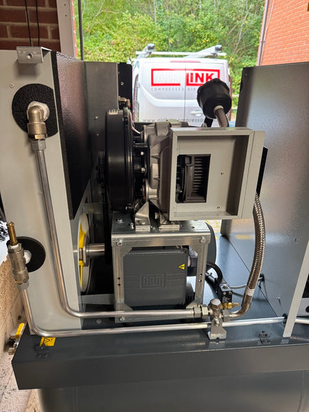 Mechanical equipment with visible branding in the background