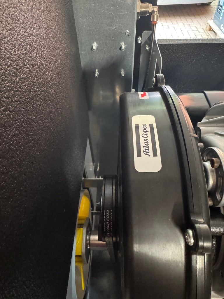 Close-up of a fishing reel with 'Albatross' branding on a dark background