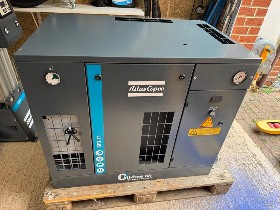 Atlas Copco air compressor on a pallet outdoors
