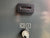 Vintage electronic device with a digital display and switch on a gray background