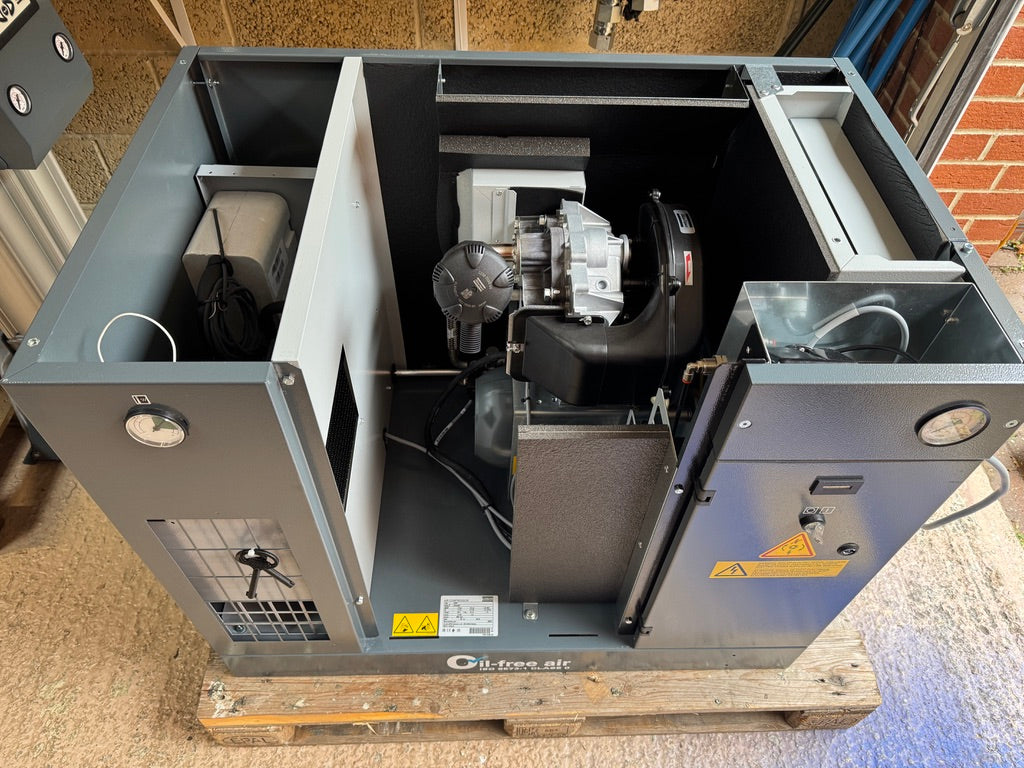 Open industrial machine on a pallet with visible components