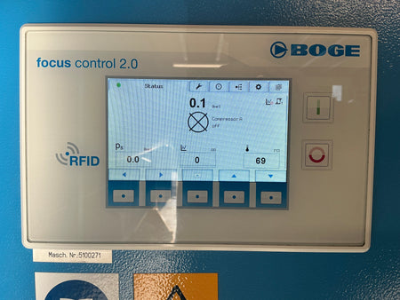 BOGE focus control 2.0 industrial touchscreen panel with blue branding, a central display screen, and several physical buttons on a blue machine surface.
