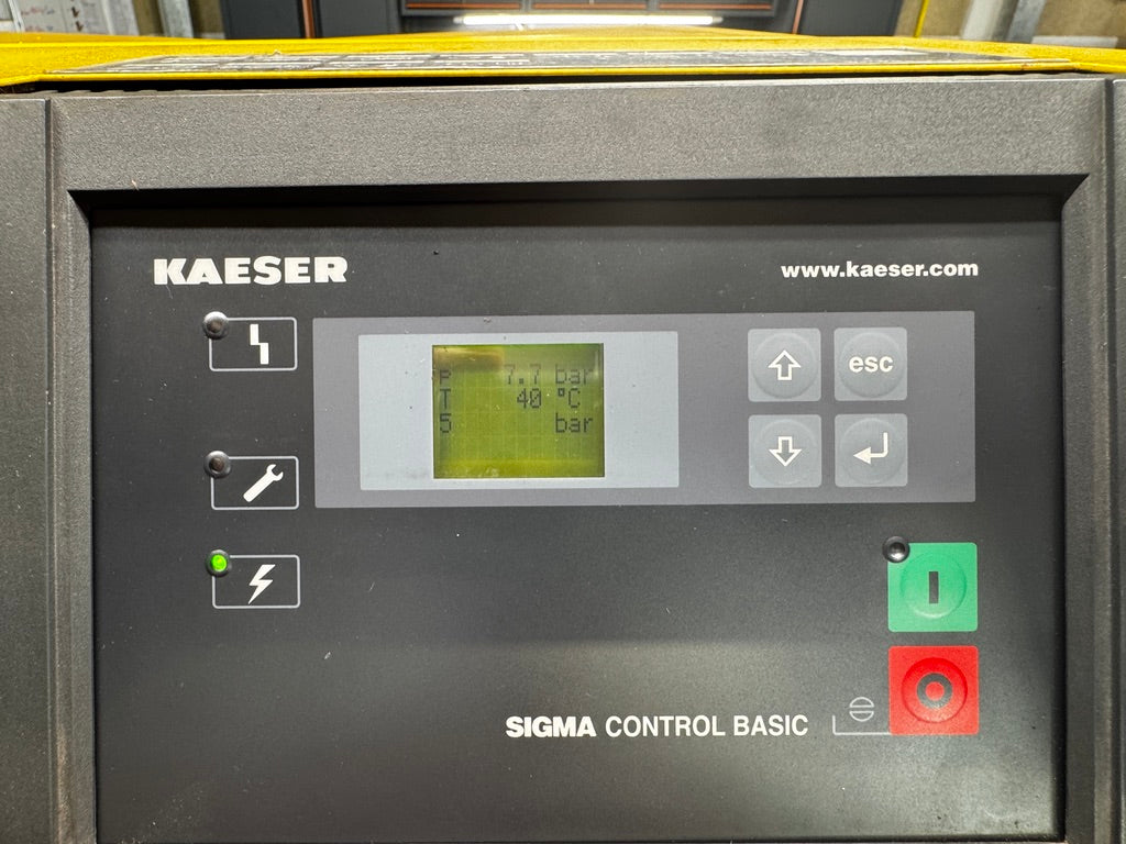Kaeser Sigma Control Basic industrial touchscreen control panel with a gray faceplate, green and red buttons, and a small display screen.
