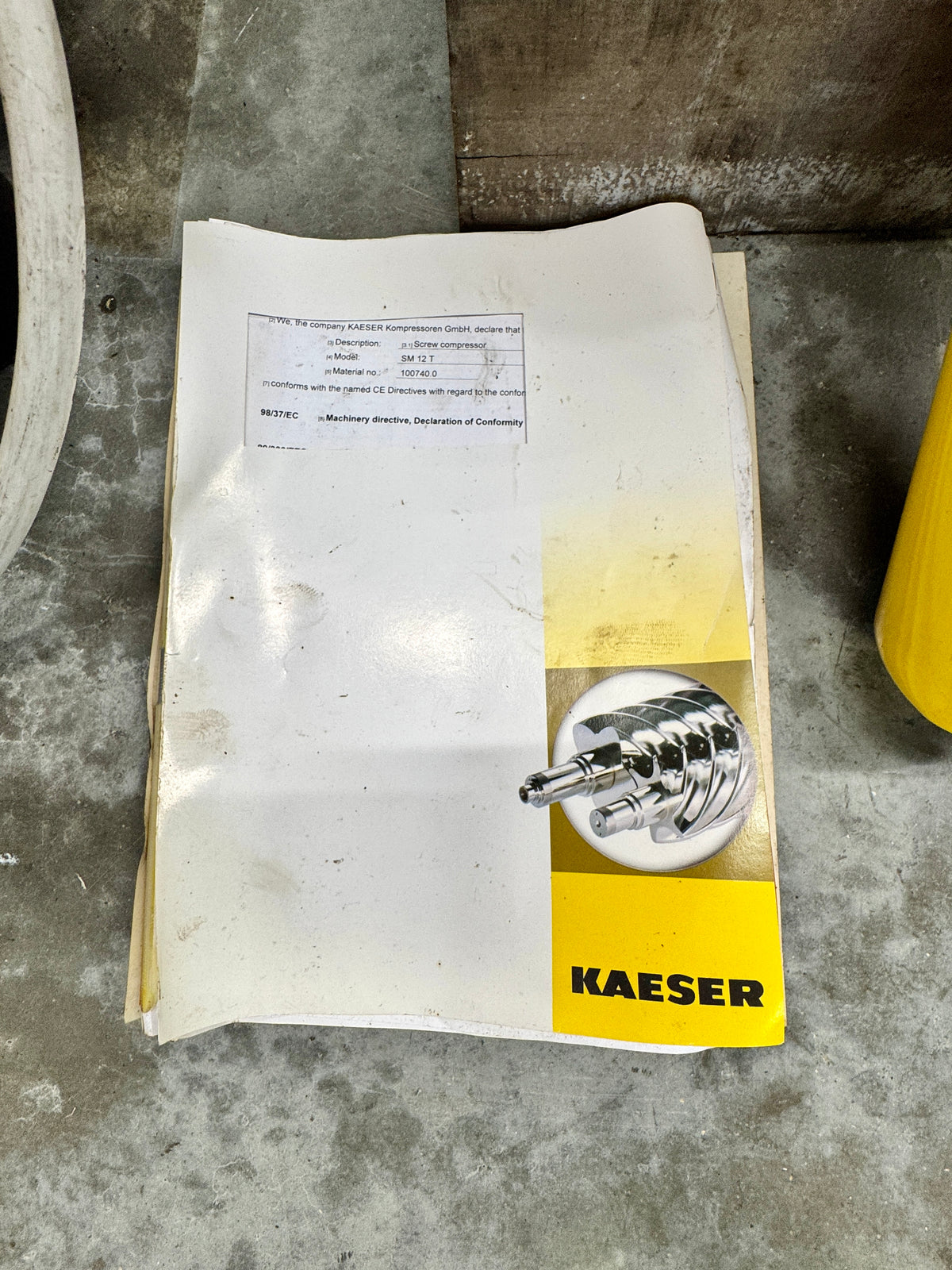 Product packaging with a Kaeser logo on a concrete surface