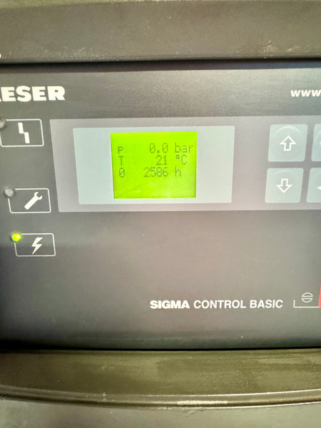 Control panel of a machine with digital display and 'SIGMA CONTROL BASIC' branding.