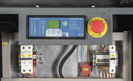 Control panel with digital display, emergency stop button, and various wiring.
