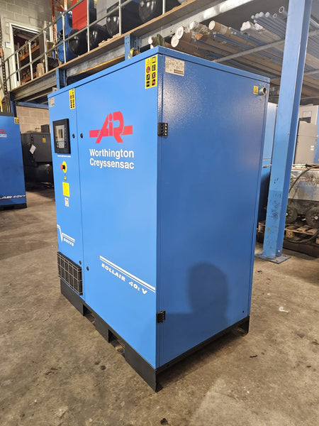 Blue compressor with 'AR' and 'Norton' branding in a warehouse setting
