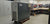Large industrial air compressor with Allen-Bradley branding in a warehouse setting.