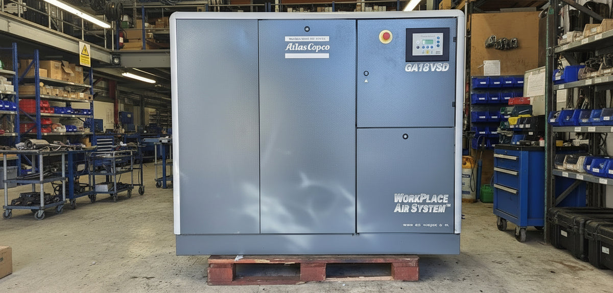 Large industrial air compressor on a pallet in a warehouse setting