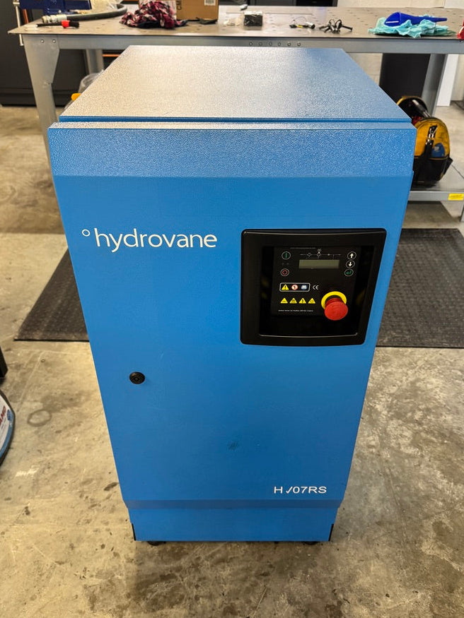 Blue Hydrovane air compressor on a workshop floor