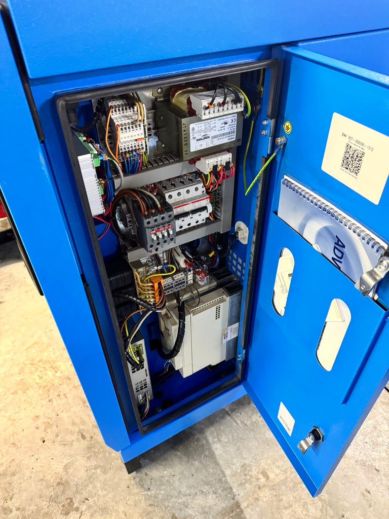 Open blue electrical panel with various components and wiring.