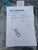 Test certificate and USB drive on a reflective surface