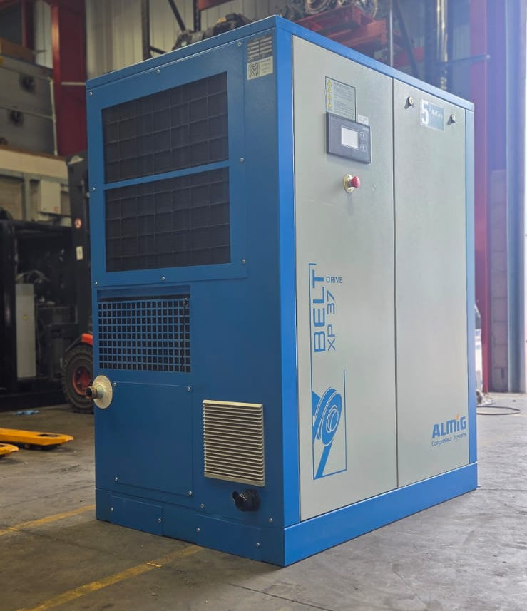 Blue industrial compressor in a warehouse setting