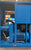 Blue industrial machine or compressor in a warehouse setting