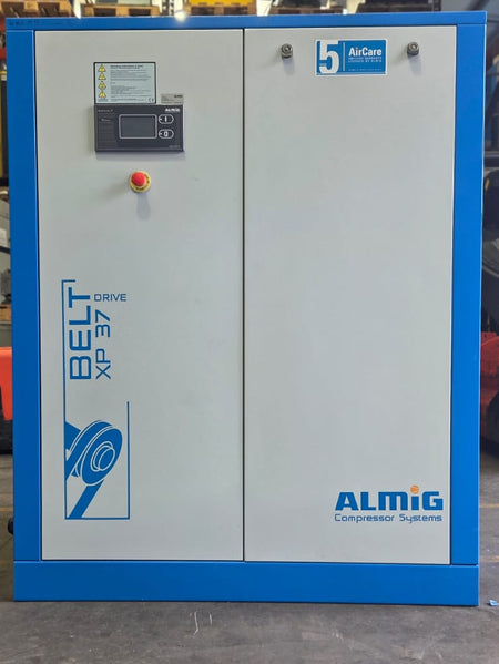 Industrial air compressor system with ALMiG branding on a gray floor.