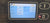 Display screen of a machine showing operational hours and other metrics.