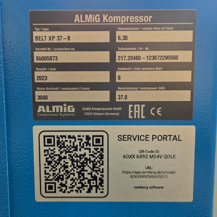 Blue machine with ALMIG Kompressor label and QR code on a blurred background