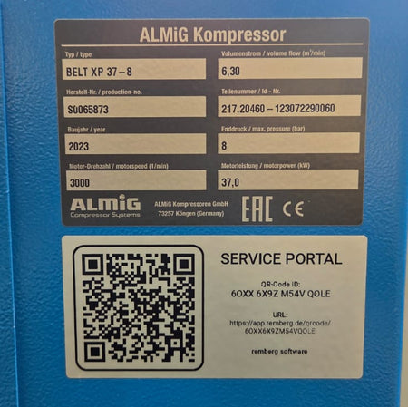 Blue machine with ALMIG Kompressor label and QR code on a blurred background